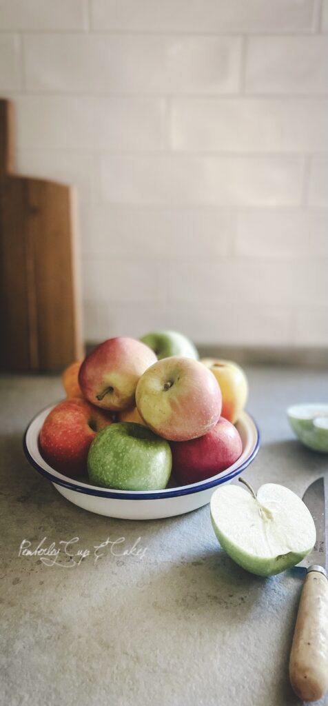Apple cut in half plus knife