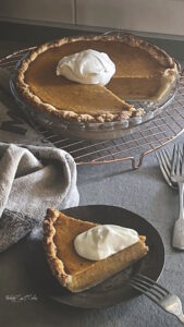 Pumpkin pie slice with cream